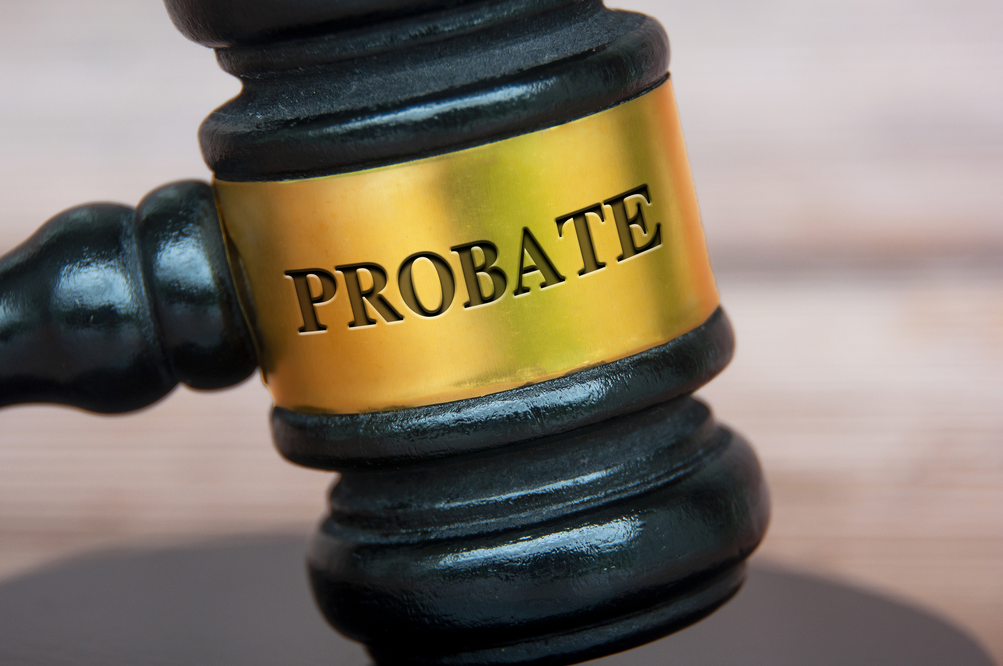 A gavel with the word "Probate" engraved on it, symbolizing the legal concept of probate